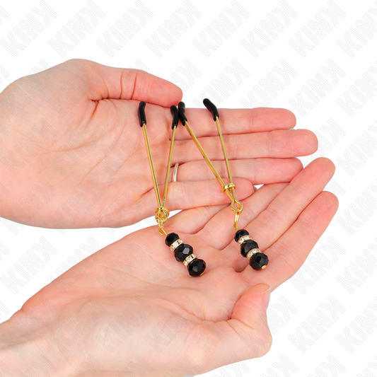 KINK - PINCES À TÉTONS EN OR FIN AVEC TRIPLE BOULE EN VERRE NOIRE 7 CM